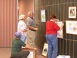 students hanging watercolors